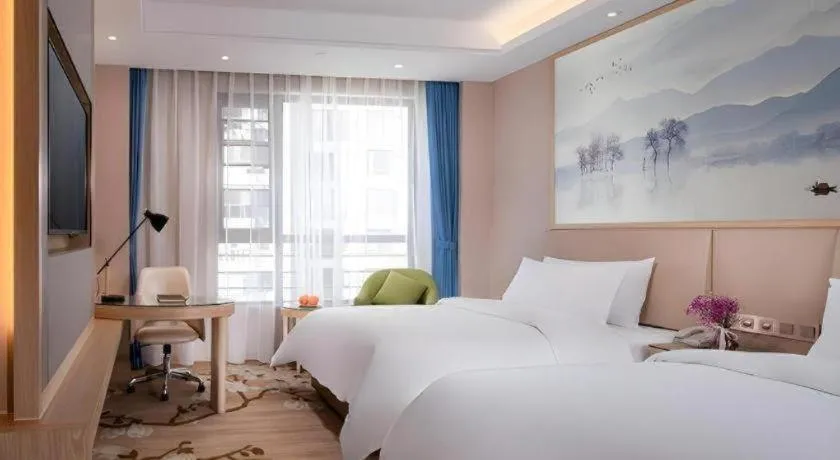 Bed in Vienna Hotel Yunnan Dali Erhai Lake