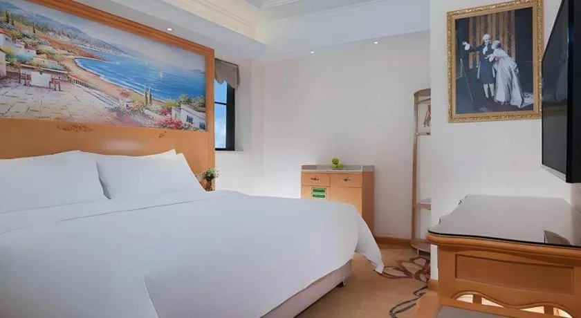 Bed in Vienna Hotel Kunming Beijing Road Chuanxin Gulou Metro Station