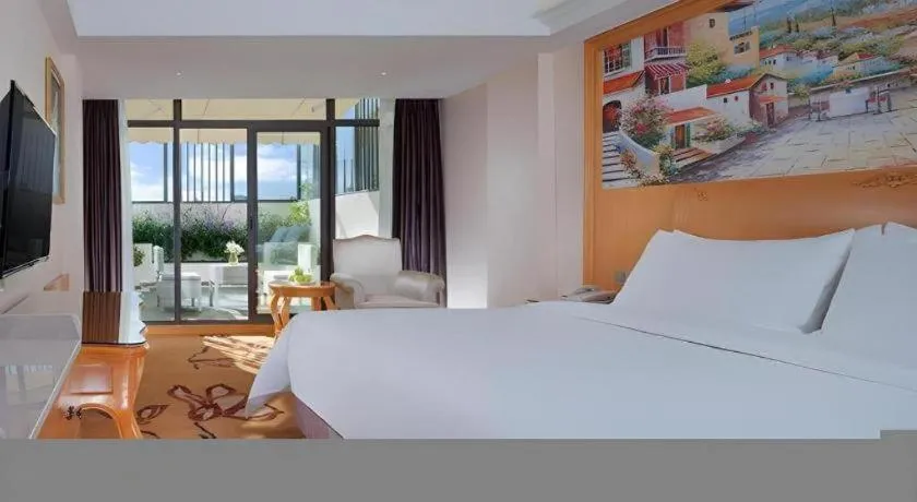 Bed in Vienna Hotel Kunming Beijing Road Chuanxin Gulou Metro Station