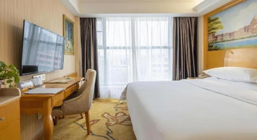 Bed in Vienna Hotel Kunming Beijing Road Chuanxin Gulou Metro Station