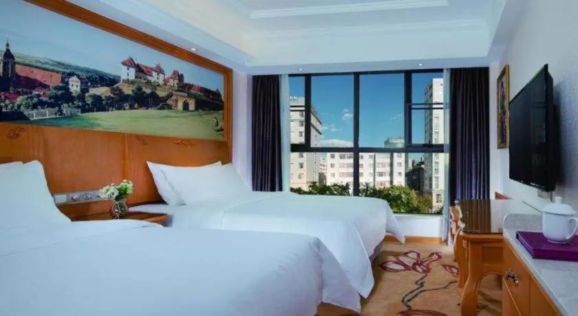 Bed in Vienna Hotel Kunming Beijing Road Chuanxin Gulou Metro Station