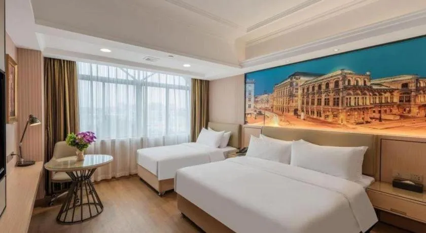 Bed in Vienna Hotel Ganzhou Economic Development Zone 1st Hospital West High-Speed Railway Station