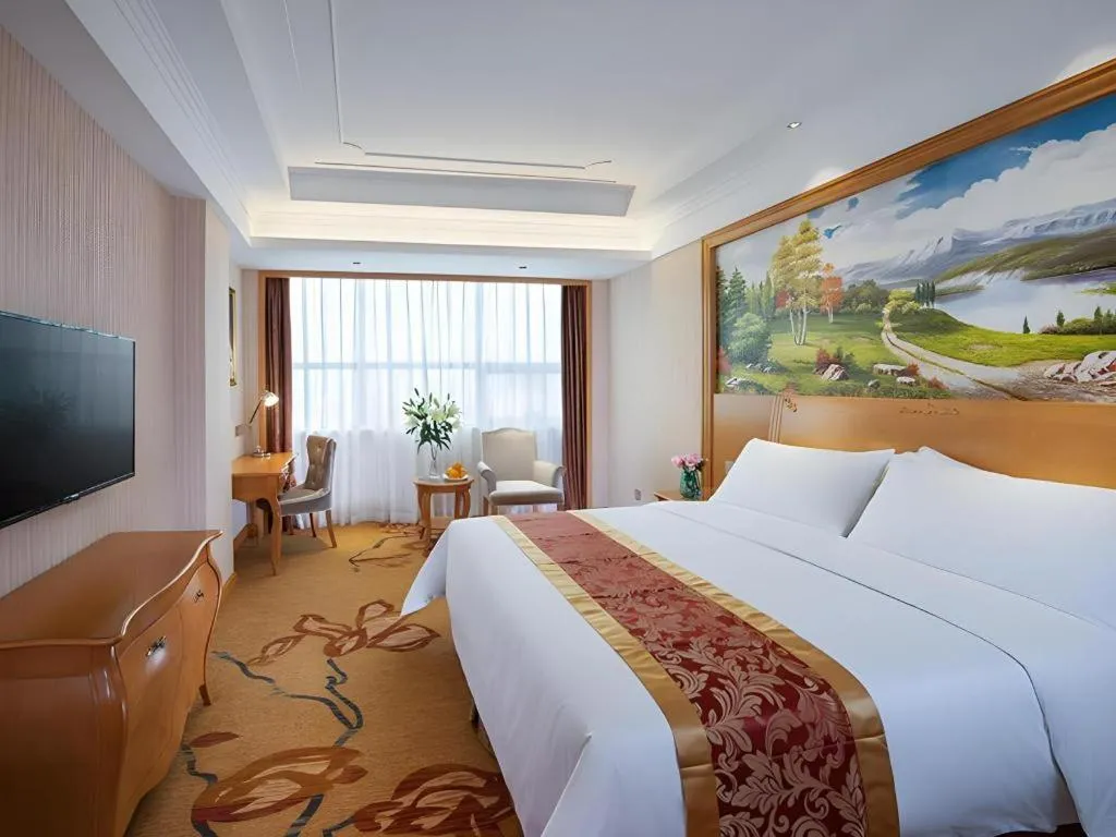 Bed in Vienna Hotel Ganzhou Economic Development Zone 1st Hospital West High-Speed Railway Station