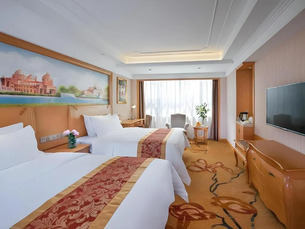 Bed in Vienna Hotel Ganzhou Economic Development Zone 1st Hospital West High-Speed Railway Station