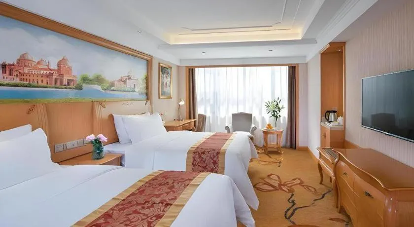Bed in Vienna Hotel Ganzhou Economic Development Zone 1st Hospital West High-Speed Railway Station