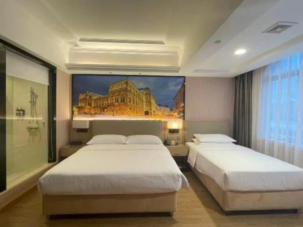 Bed in Vienna Hotel Ganzhou Economic Development Zone 1st Hospital West High-Speed Railway Station
