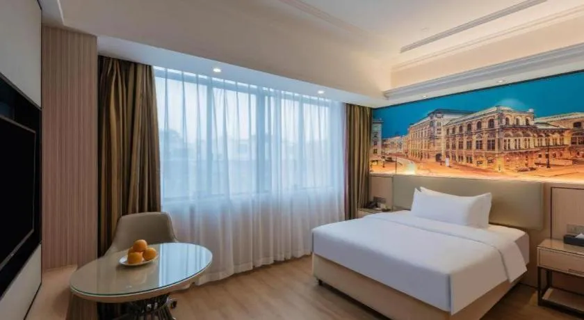 Bed in Vienna Hotel Ganzhou Economic Development Zone 1st Hospital West High-Speed Railway Station