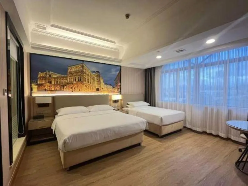 Bed in Vienna Hotel Ganzhou Economic Development Zone 1st Hospital West High-Speed Railway Station