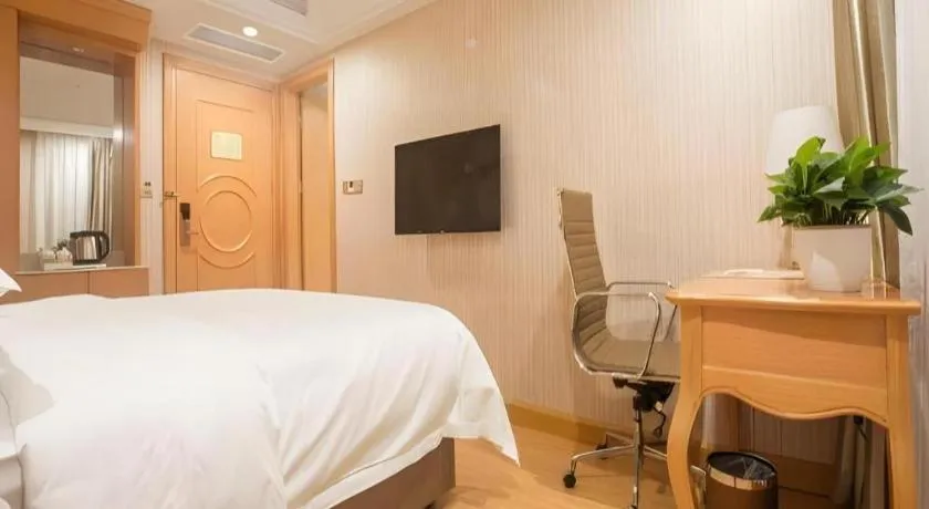 Bed in Vienna Hotel Shanghai Hongqiao National Exhibition Cente Sijing Metro Station