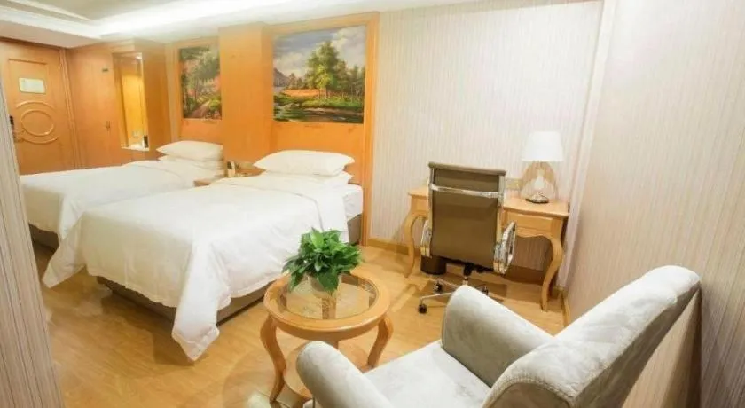 Bed in Vienna Hotel Shanghai Hongqiao National Exhibition Cente Sijing Metro Station