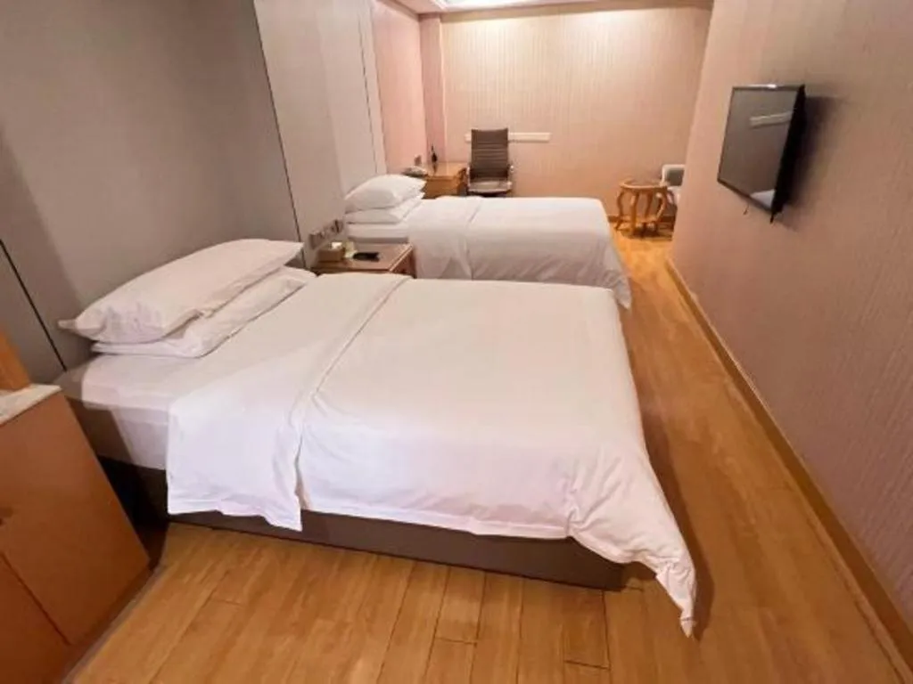 Bed in Vienna Hotel Shanghai Hongqiao National Exhibition Cente Sijing Metro Station