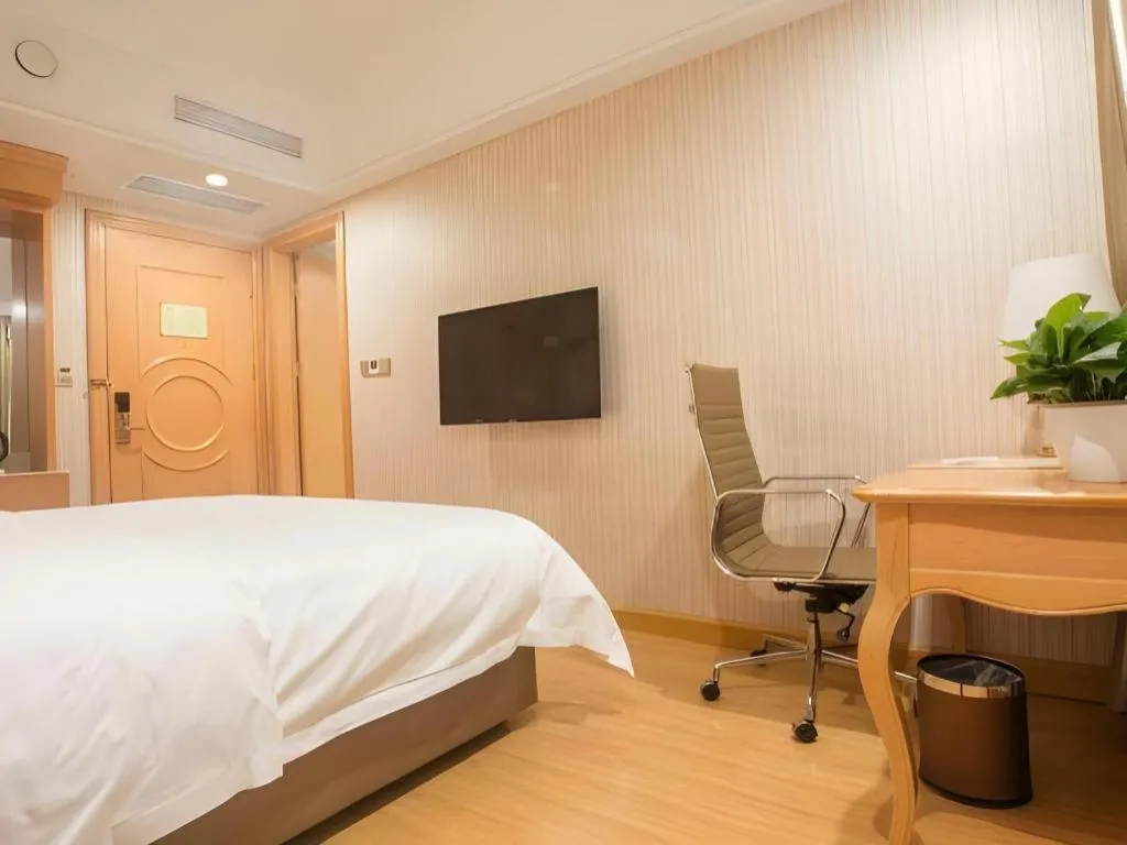 Bed in Vienna Hotel Shanghai Hongqiao National Exhibition Cente Sijing Metro Station