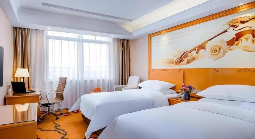 Bed in Vienna Hotel Shanghai Hongqiao National Exhibition Cente Sijing Metro Station