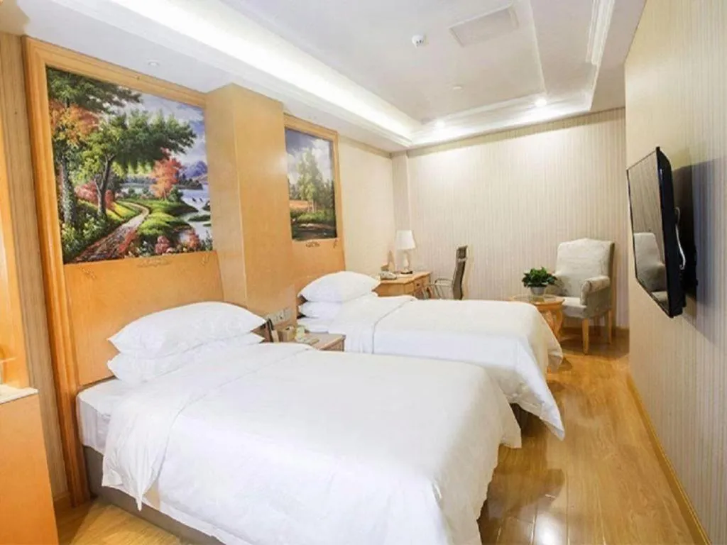 Bed in Vienna Hotel Shanghai Hongqiao National Exhibition Cente Sijing Metro Station