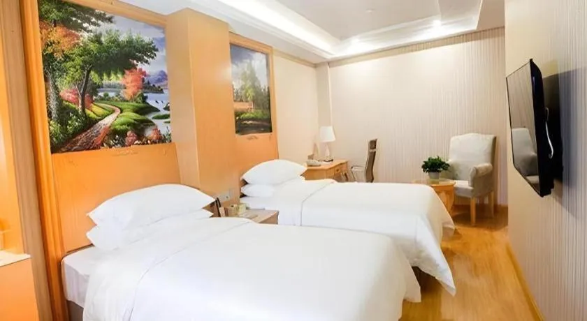Bed in Vienna Hotel Shanghai Hongqiao National Exhibition Cente Sijing Metro Station