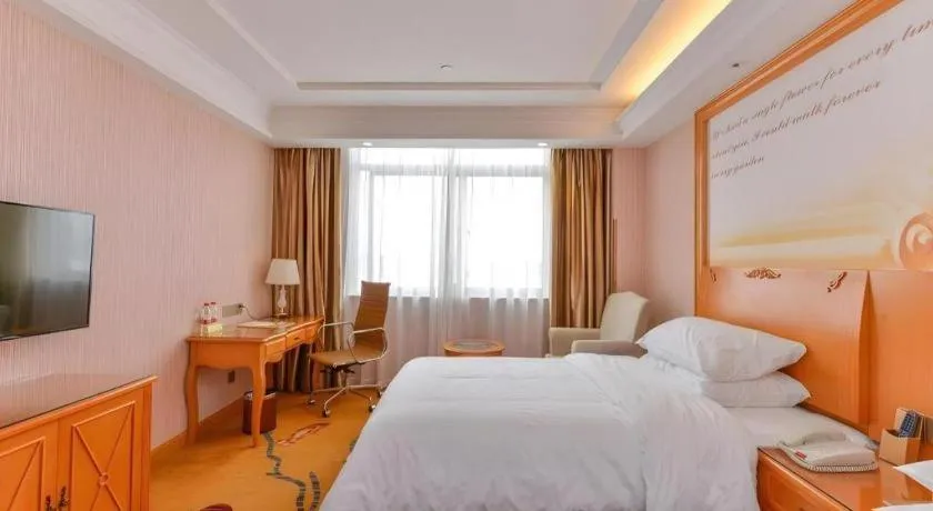 Bed in Vienna Hotel Shanghai Hongqiao National Exhibition Cente Sijing Metro Station