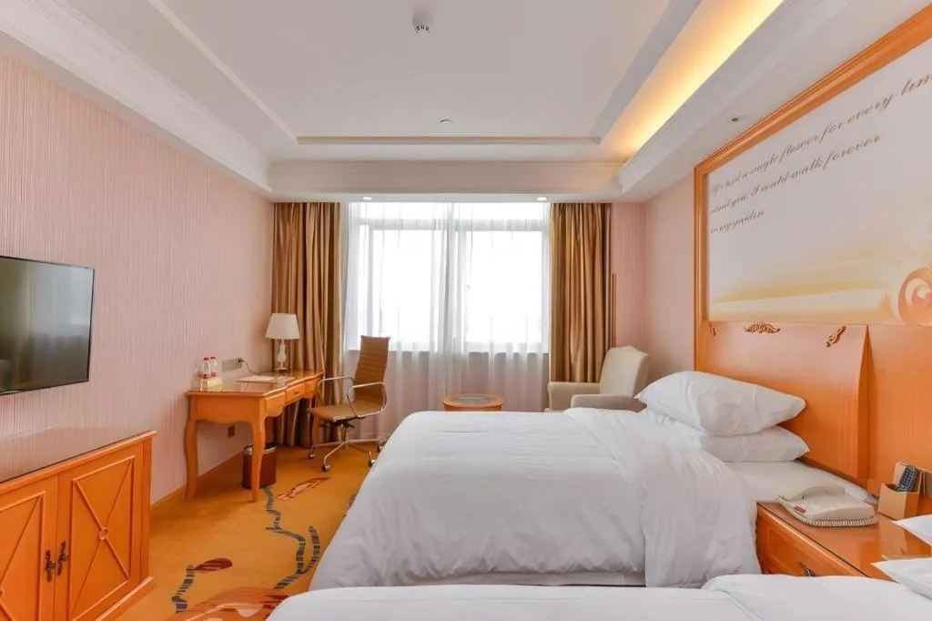 Bed in Vienna Hotel Shanghai Hongqiao National Exhibition Cente Sijing Metro Station