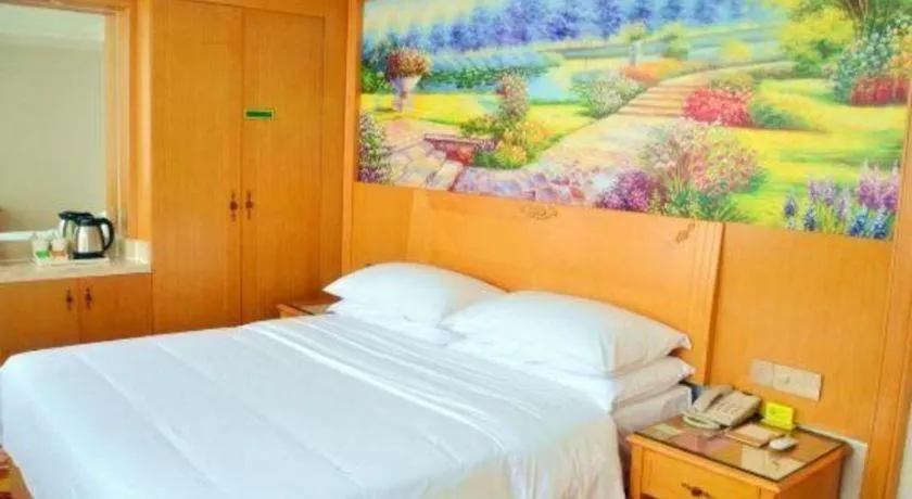 Bed in Vienna Hotel Guangdong Zhaoqing Sihui Center Jade Expo Market