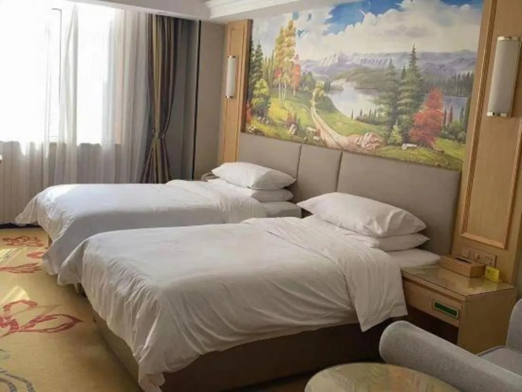Bed in Vienna Hotel Shandong Linyi Mengyin