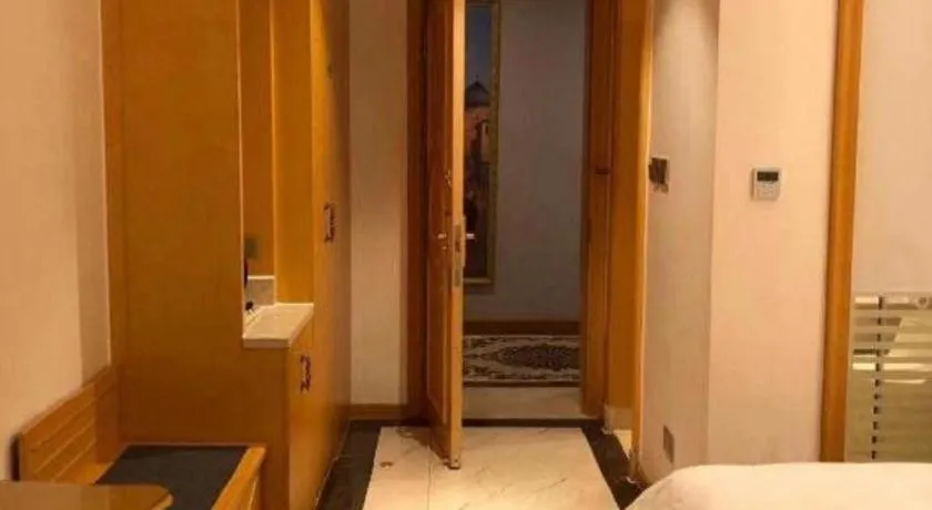 Bed in Vienna Hotel Guangdong Zhaoqing Sihui Tianguangxu