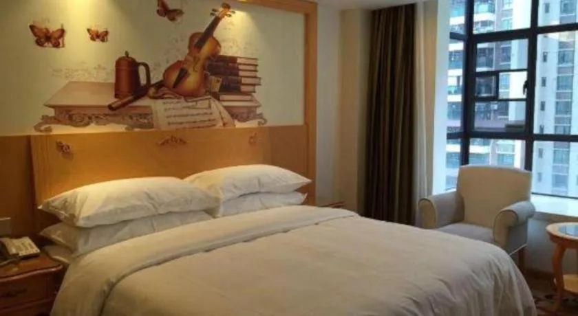 Bed in Vienna Hotel Guangdong Zhaoqing Sihui Tianguangxu