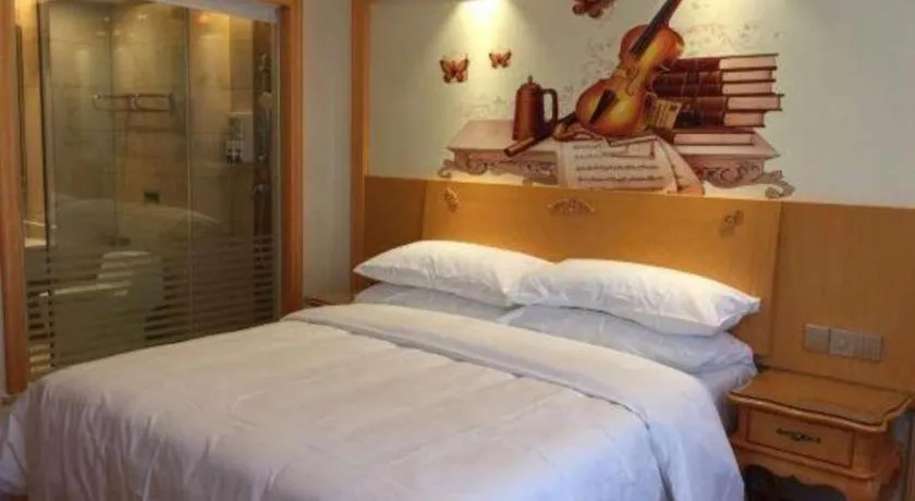 Bed in Vienna Hotel Guangdong Zhaoqing Sihui Tianguangxu