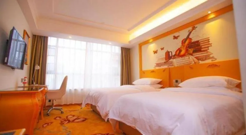 Bed in Vienna Hotel Guangdong Zhaoqing Sihui Tianguangxu