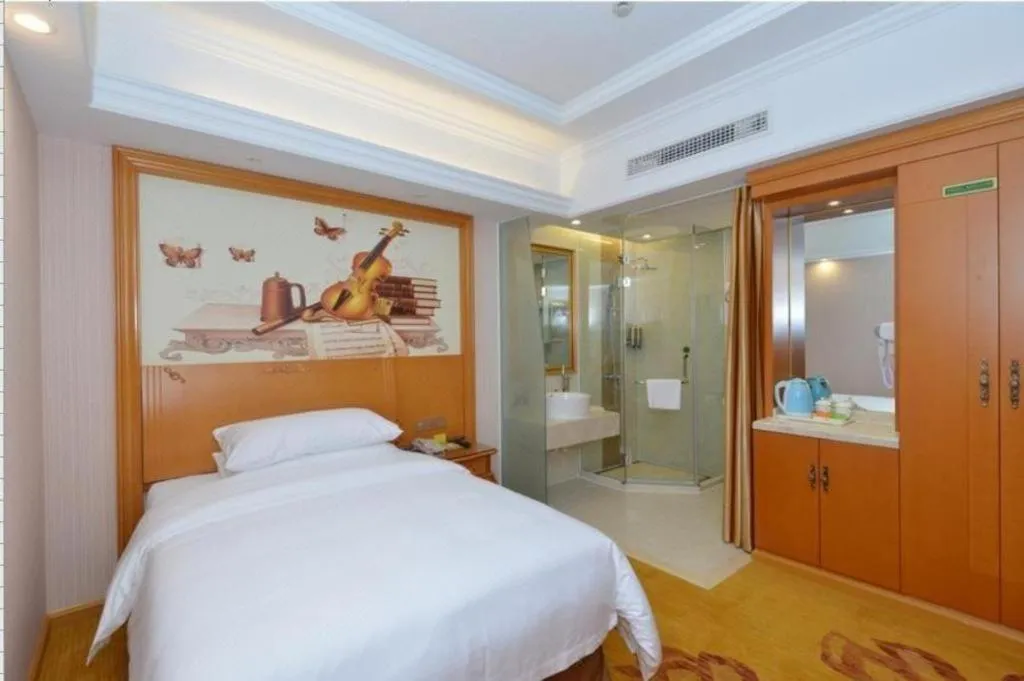 Bed in Vienna Hotel Shanghai Songjiang Market Miaoqian Street