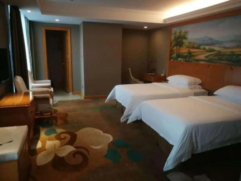 Bed in Vienna Hotel Guangdong Zhongshan Ancient Town Haizhou