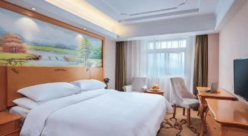 Bed in Vienna Hotel Guangdong Zhongshan Ancient Town Haizhou