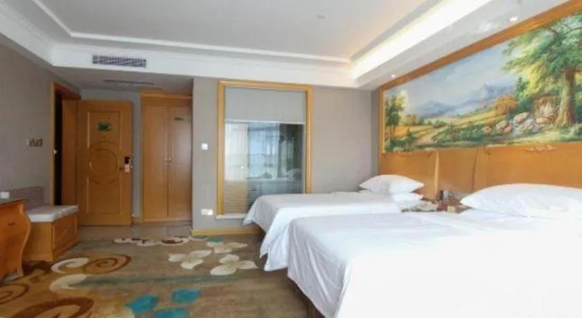 Bed in Vienna Hotel Guangdong Zhongshan Ancient Town Haizhou