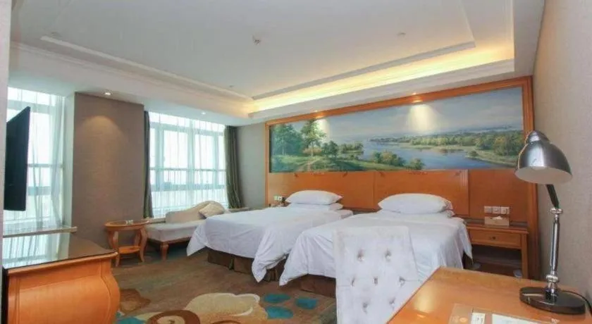 Bed in Vienna Hotel Guangdong Zhongshan Ancient Town Haizhou