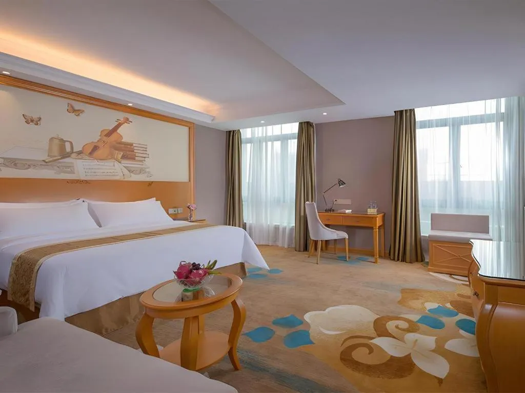 Bed in Vienna Hotel Guangdong Zhongshan Ancient Town Haizhou