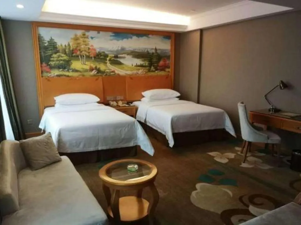 Bed in Vienna Hotel Guangdong Zhongshan Ancient Town Haizhou