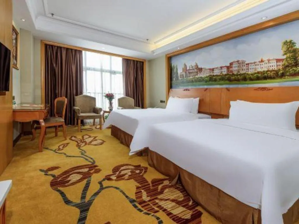 Bed in Vienna Hotel Nanning Anji Wanda 33rd Middle School Metro Station