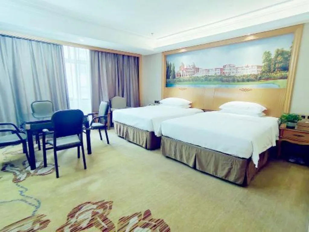 Bed in Vienna Hotel Nanning Anji Wanda 33rd Middle School Metro Station