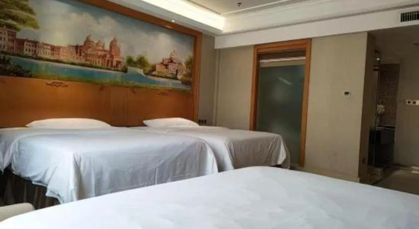 Bed in Vienna Hotel Nanning Anji Wanda 33rd Middle School Metro Station