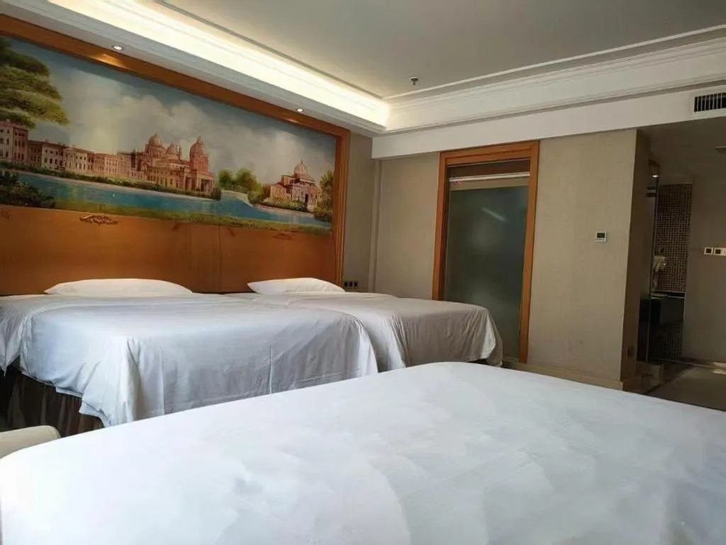 Bed in Vienna Hotel Nanning Anji Wanda 33rd Middle School Metro Station