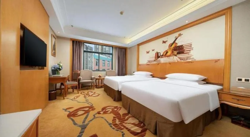 Bed in Vienna Hotel Nanning Anji Wanda 33rd Middle School Metro Station