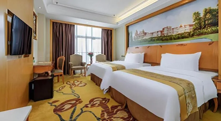 Bed in Vienna Hotel Nanning Anji Wanda 33rd Middle School Metro Station