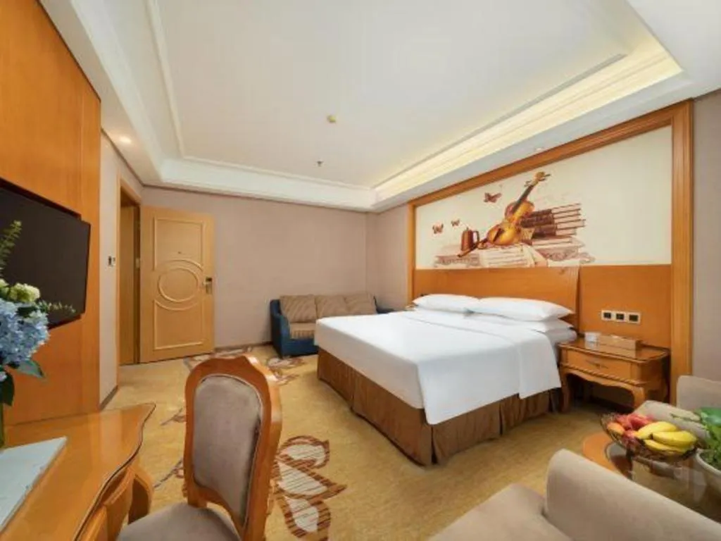 Bed in Vienna Hotel Nanning Anji Wanda 33rd Middle School Metro Station