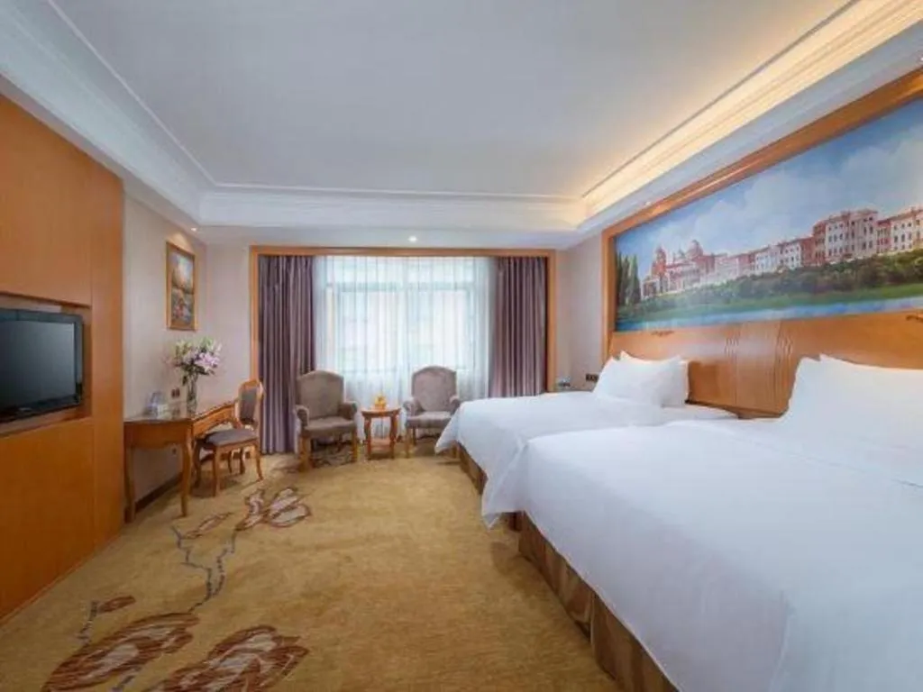 Bed in Vienna Hotel Nanning Anji Wanda 33rd Middle School Metro Station