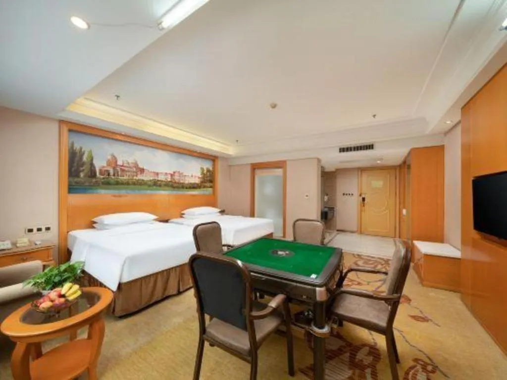 Bed in Vienna Hotel Nanning Anji Wanda 33rd Middle School Metro Station