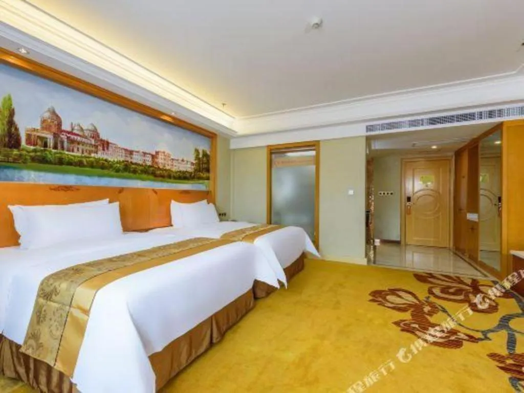Bed in Vienna Hotel Nanning Anji Wanda 33rd Middle School Metro Station