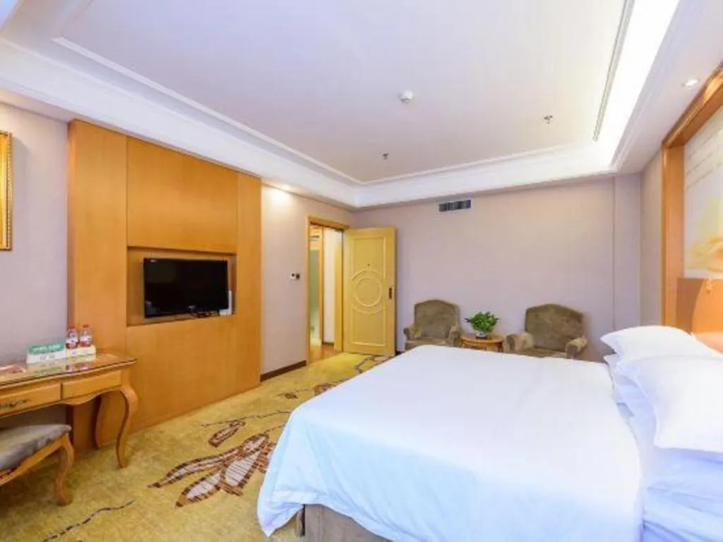 Bed in Vienna Hotel Nanning Anji Wanda 33rd Middle School Metro Station