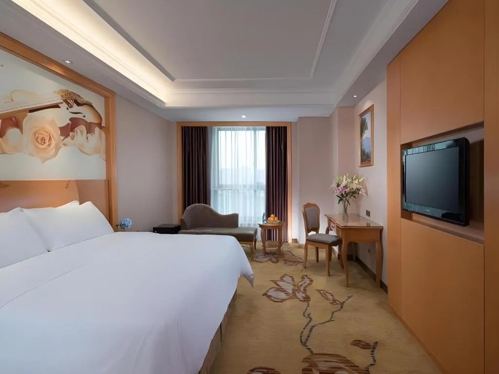 Bed in Vienna Hotel Nanning Anji Wanda 33rd Middle School Metro Station