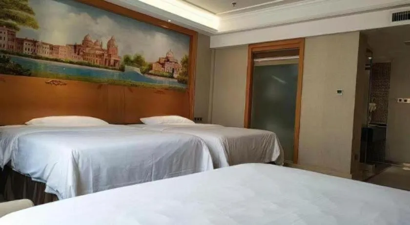 Bed in Vienna Hotel Nanning Anji Wanda 33rd Middle School Metro Station