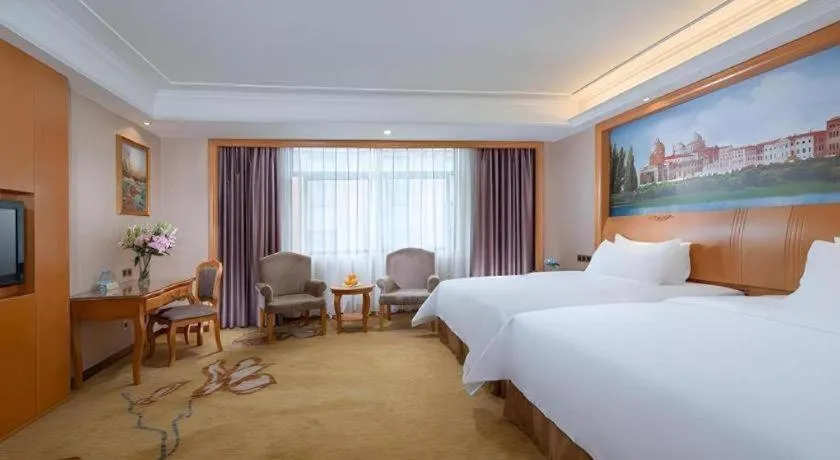 Bed in Vienna Hotel Nanning Anji Wanda 33rd Middle School Metro Station