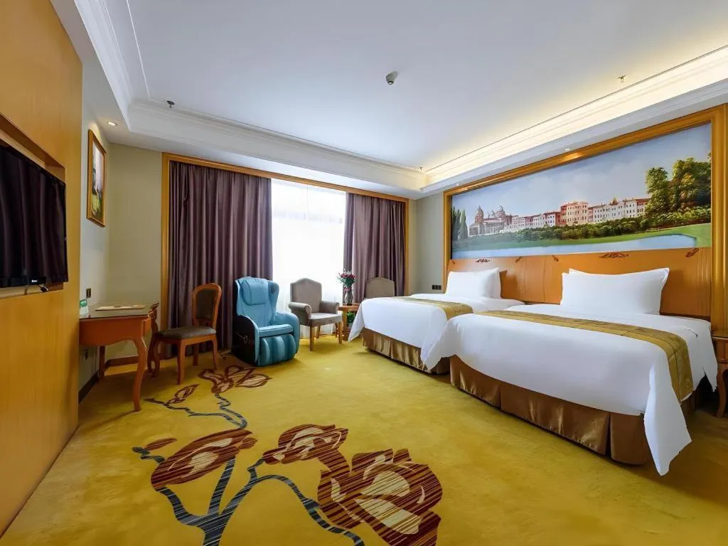 Bed in Vienna Hotel Nanning Anji Wanda 33rd Middle School Metro Station