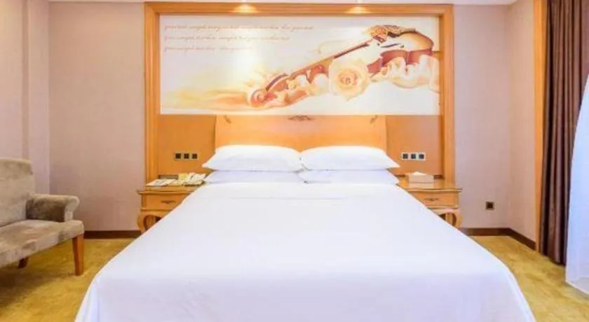 Bed in Vienna Hotel Nanning Anji Wanda 33rd Middle School Metro Station
